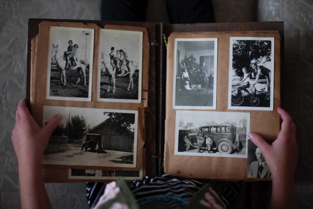 Old scrapbook with black and white photos